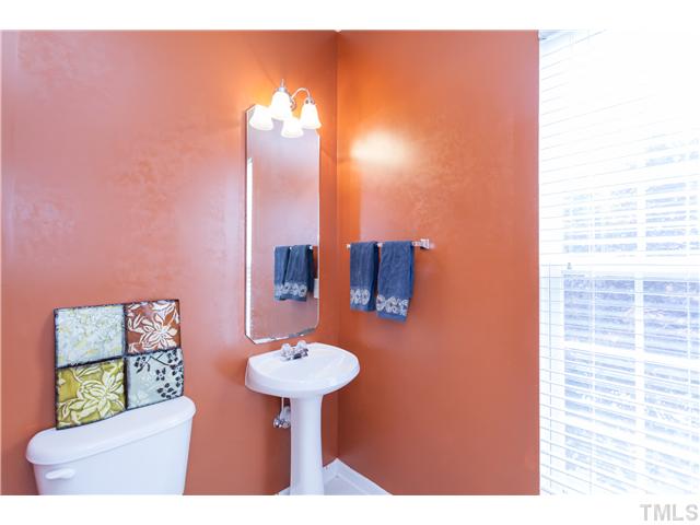 7242 Galon Glen Road Raleigh, NC 27613 - Photo 10 of 17 a bathroom with a sink and a mirror