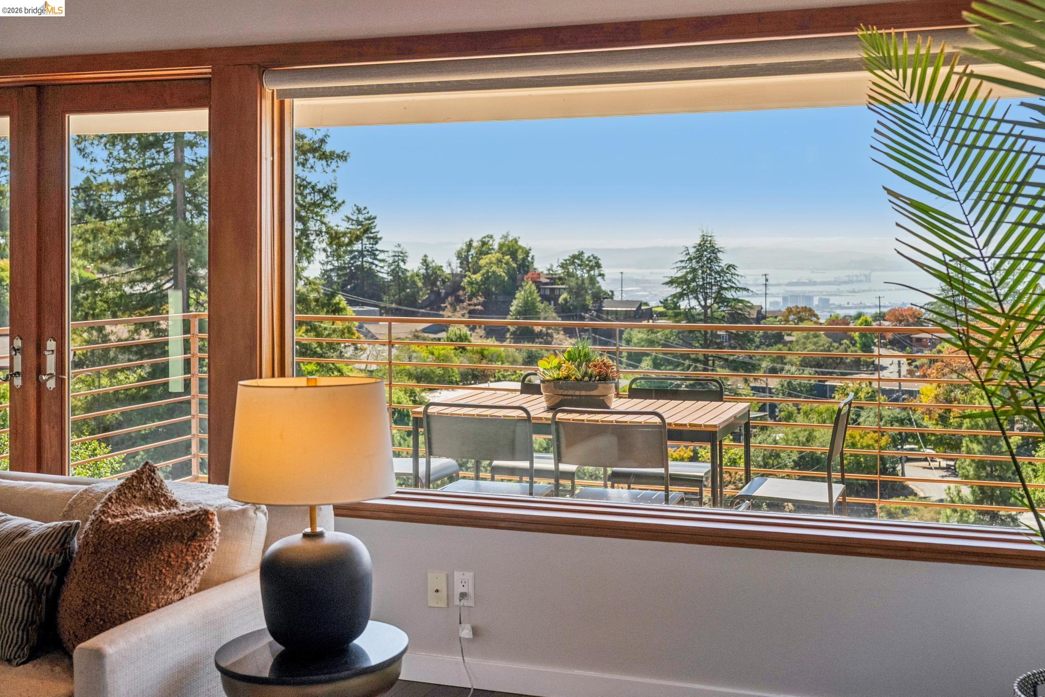1394 Queens Road Berkeley, CA 94708 - Photo 8 of 63 Expansive windows framing a distant body of water and surrounding topography