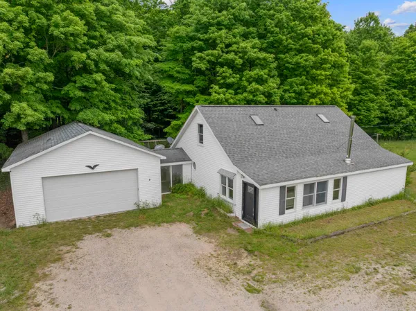 $295,500 | 10080 Homestead Road, Beulah, MI 49617