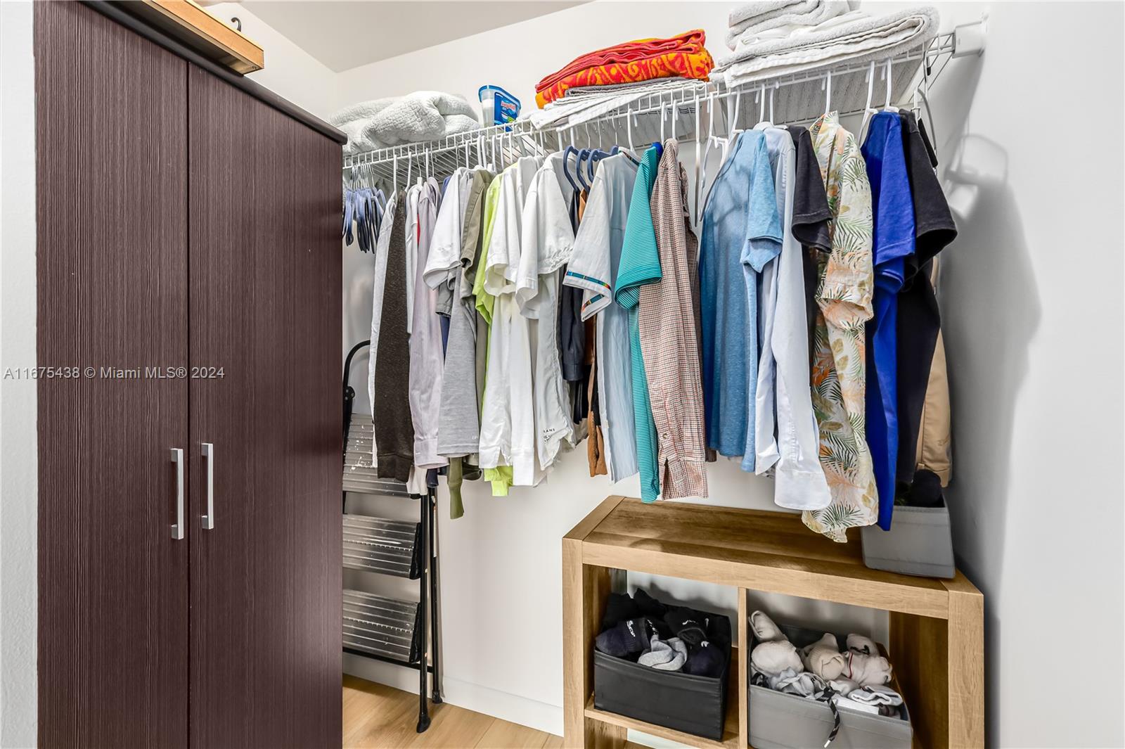 333 Northeast 24th Street, Unit 1206 Miami, FL 33137 - Photo 15 of 26 a view of walk in closet with clothes