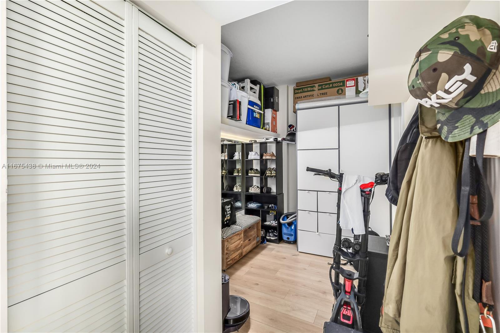 333 Northeast 24th Street, Unit 1206 Miami, FL 33137 - Photo 16 of 26 a view of a closet with storage