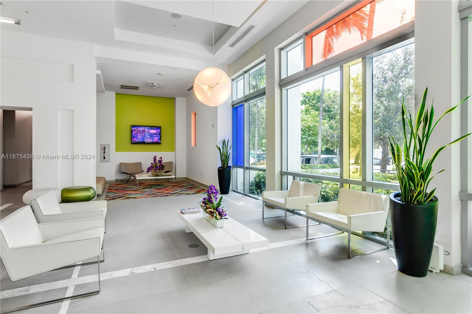 333 Northeast 24th Street, Unit 1206 Miami, FL 33137 - Photo 20 of 26 a living room with furniture and a potted plant