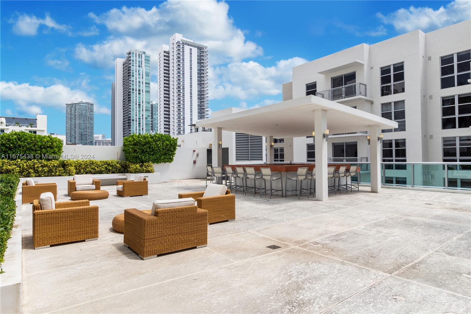333 Northeast 24th Street, Unit 1206 Miami, FL 33137 - Photo 22 of 26 a patio with sofas fire pit and outdoor seating