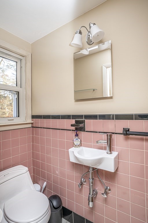 223 Marion Road Rochester, MA 02770 - Photo 28 of 35 a bathroom with a toilet a sink and mirror
