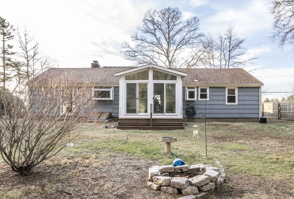 223 Marion Road Rochester, MA 02770 - Photo 4 of 35 a front view of a house with a yard and garage