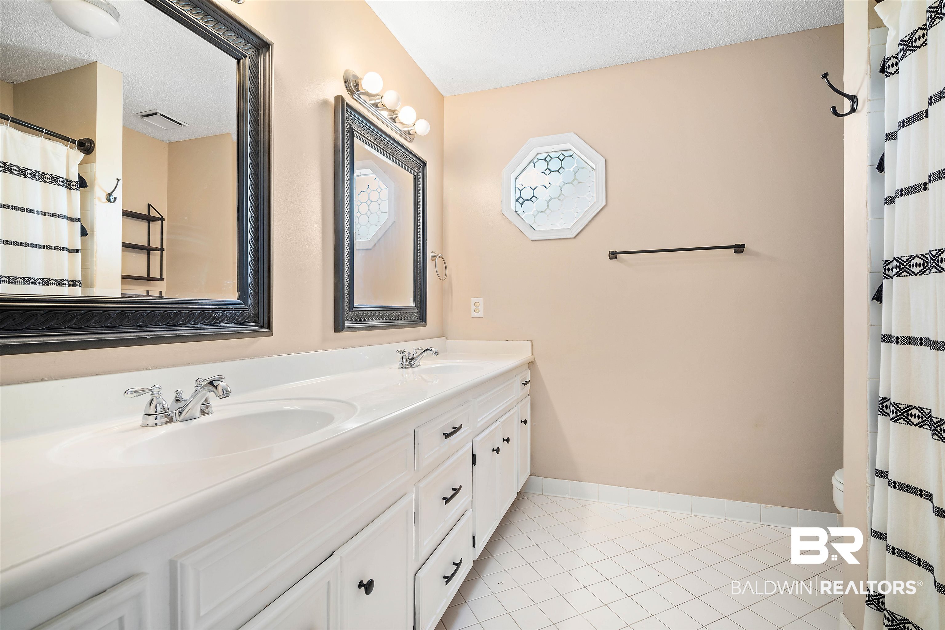 804 Wildwood Avenue Mobile, AL 36609 - Photo 19 of 30 Bathroom featuring toilet, tile patterned floors, vanity, a textured ceiling, and a shower with shower curtain
