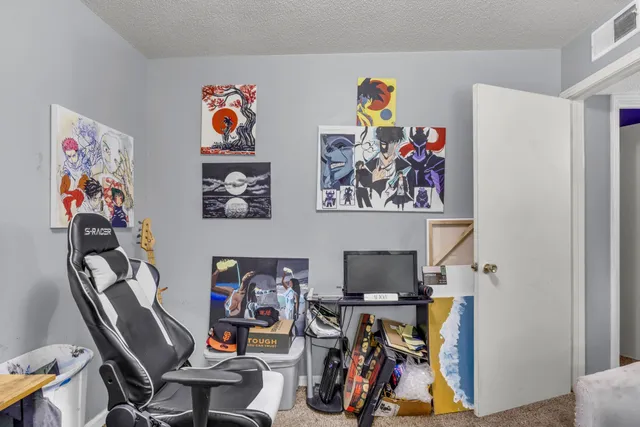 a bedroom with a bed and a couch