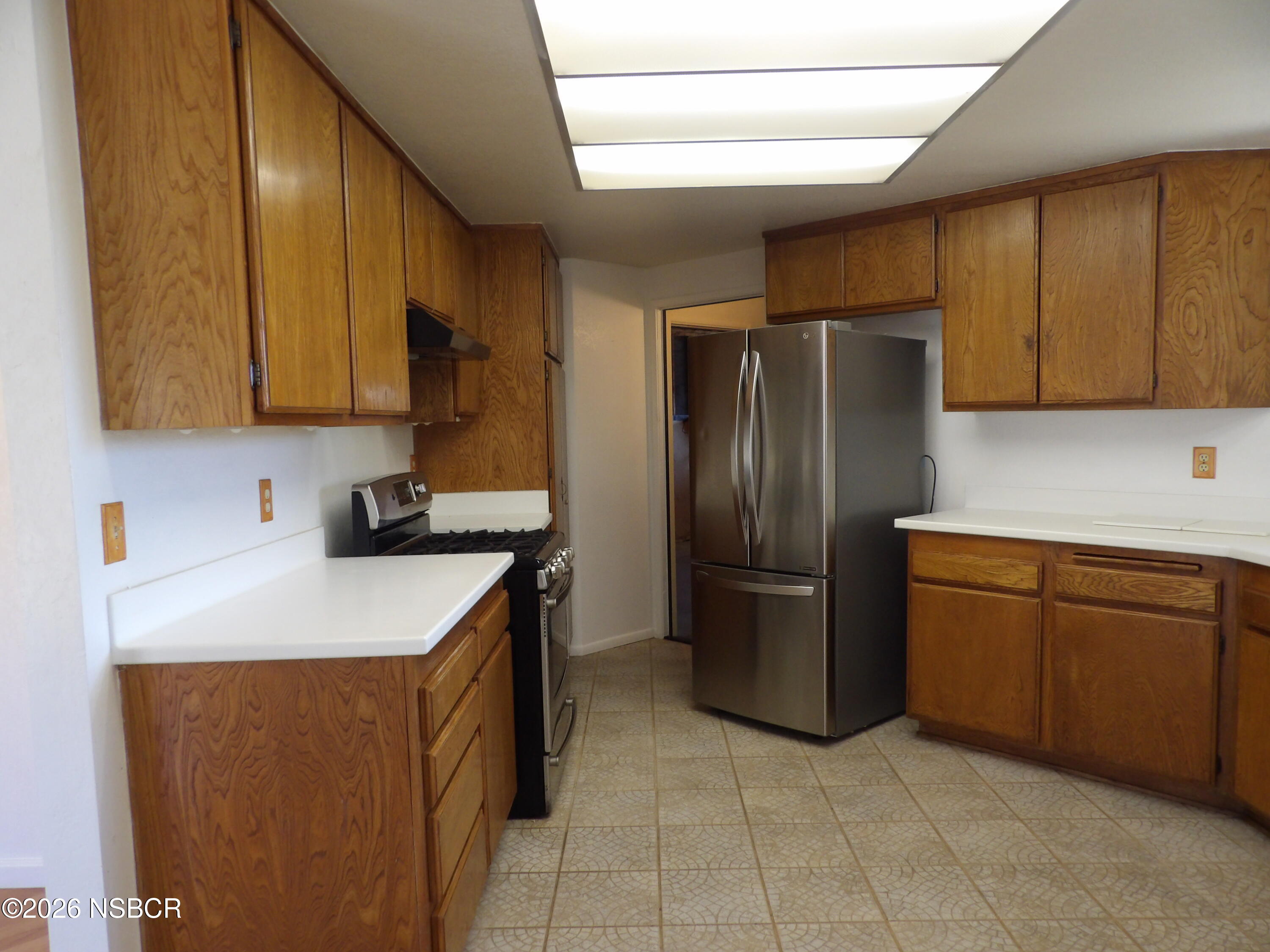 1617 Alexander Avenue Lompoc, CA 93436 - Photo 7 of 18 kitchen cupbaords and fridge