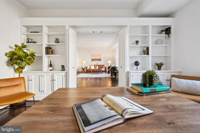 a living room with furniture and a table