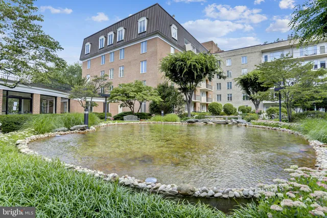 a view of a house with swimming pool and a yard