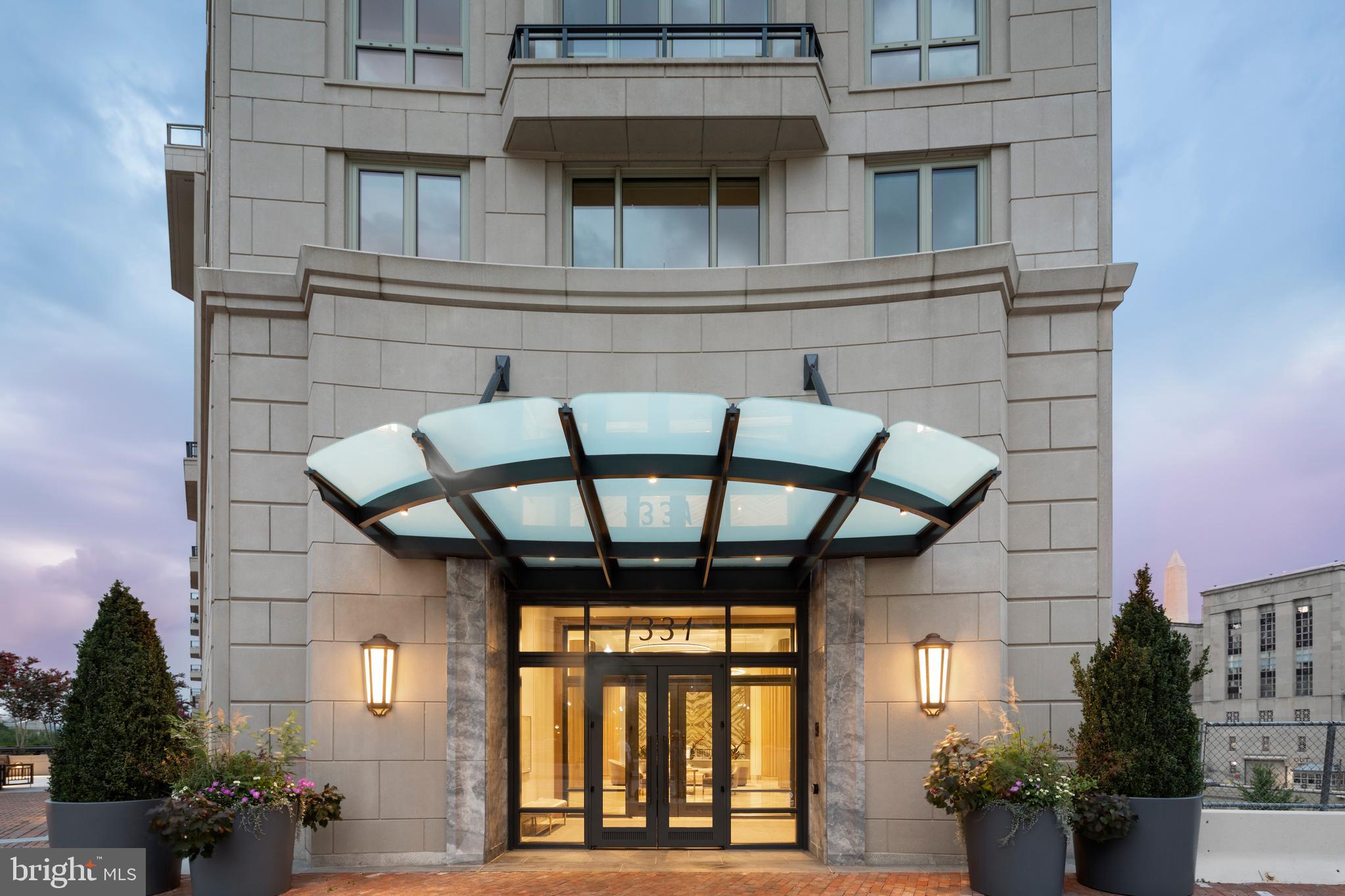 1331 Maryland Avenue Southwest, Unit PH07/VARIES Washington, DC 20024 - Photo 1 of 14 a view of entryway with a front door and wooden floor