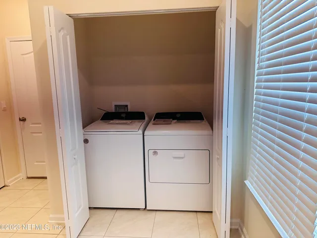 a utility room with dryer and washer