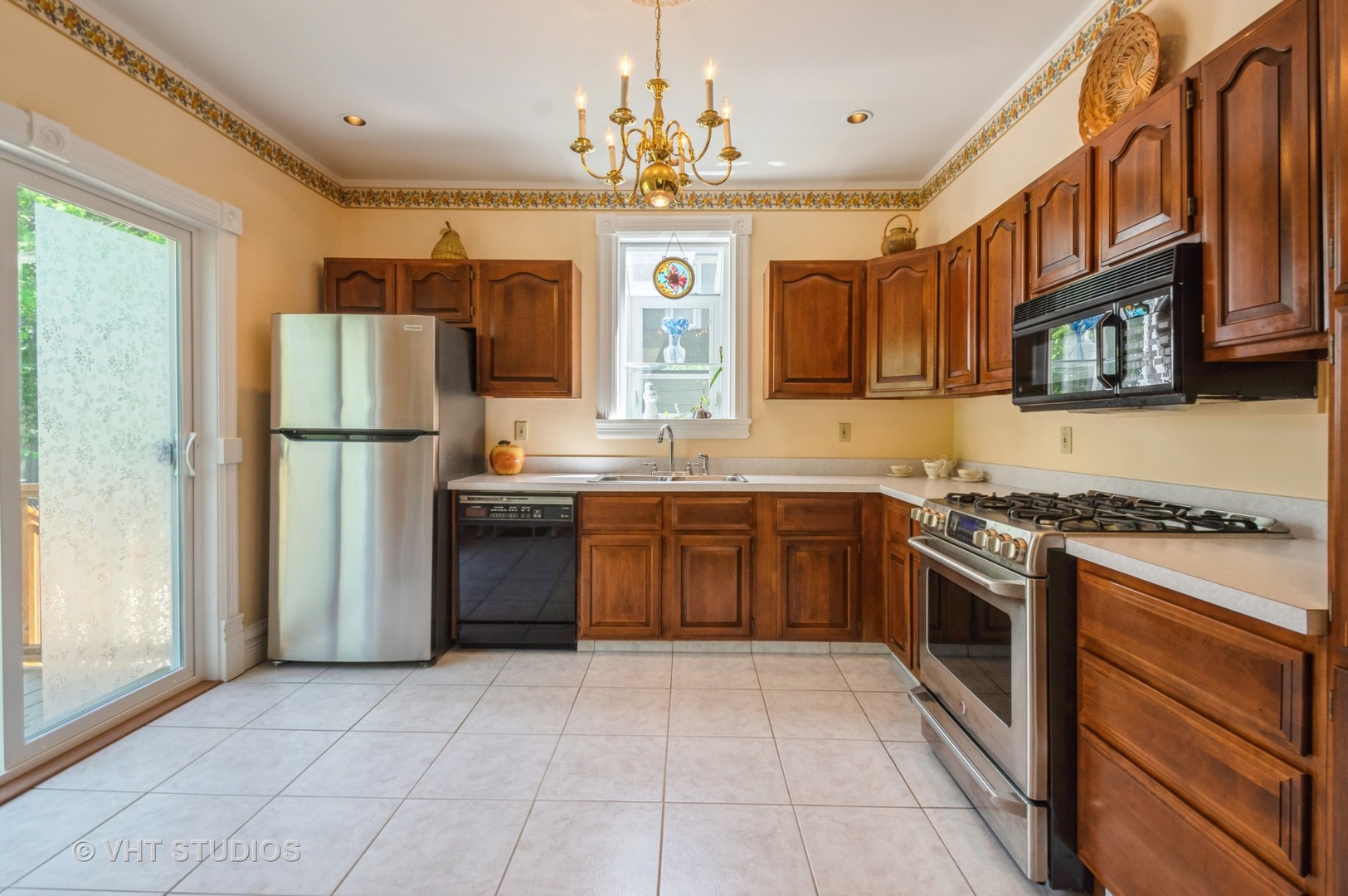 128 Forest Avenue Riverside, IL 60546 - Photo 4 of 18 a kitchen with stainless steel appliances granite countertop a stove top oven a refrigerator a sink and dishwasher