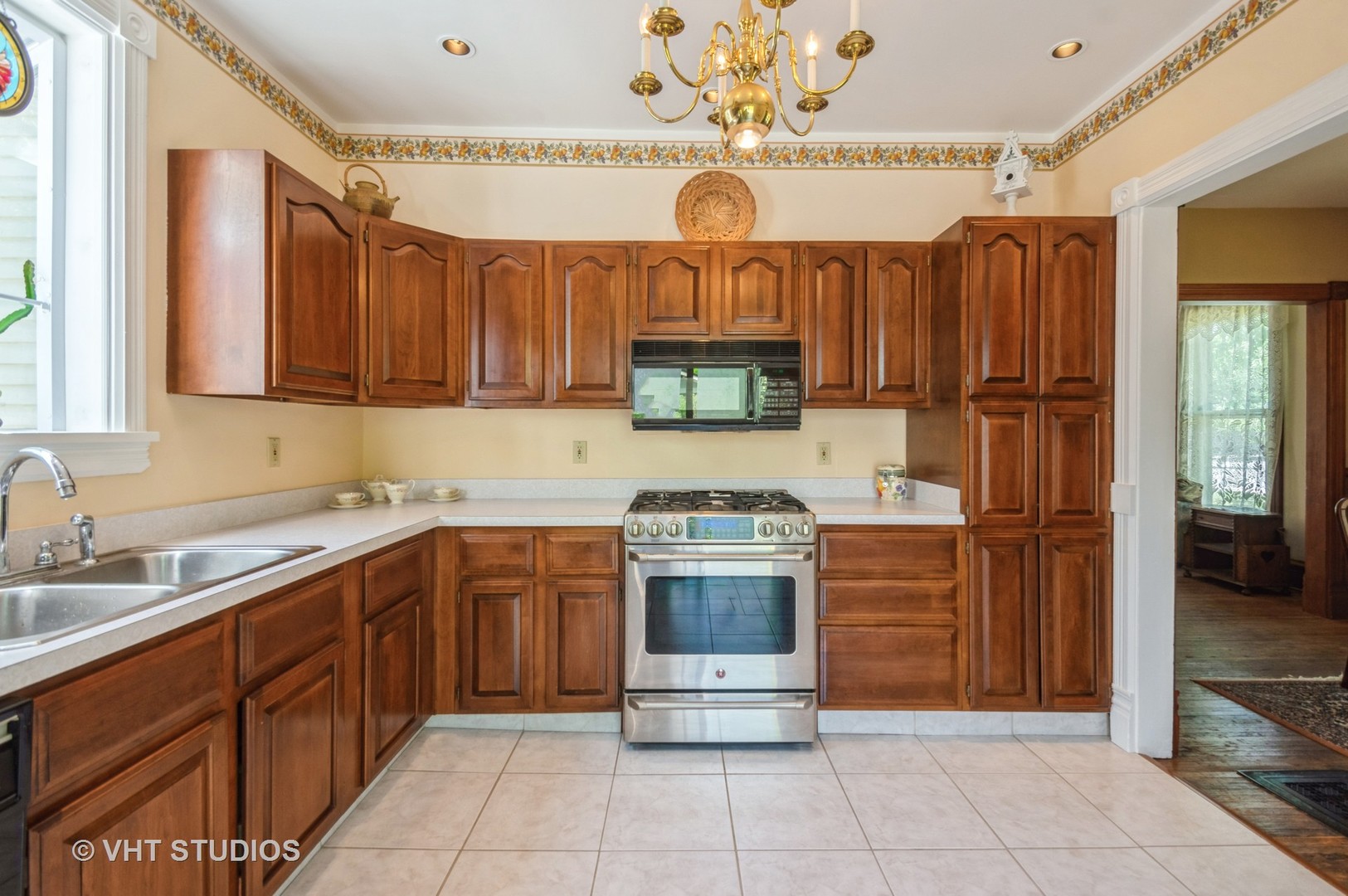 128 Forest Avenue Riverside, IL 60546 - Photo 5 of 18 a kitchen with stainless steel appliances granite countertop a sink and cabinets