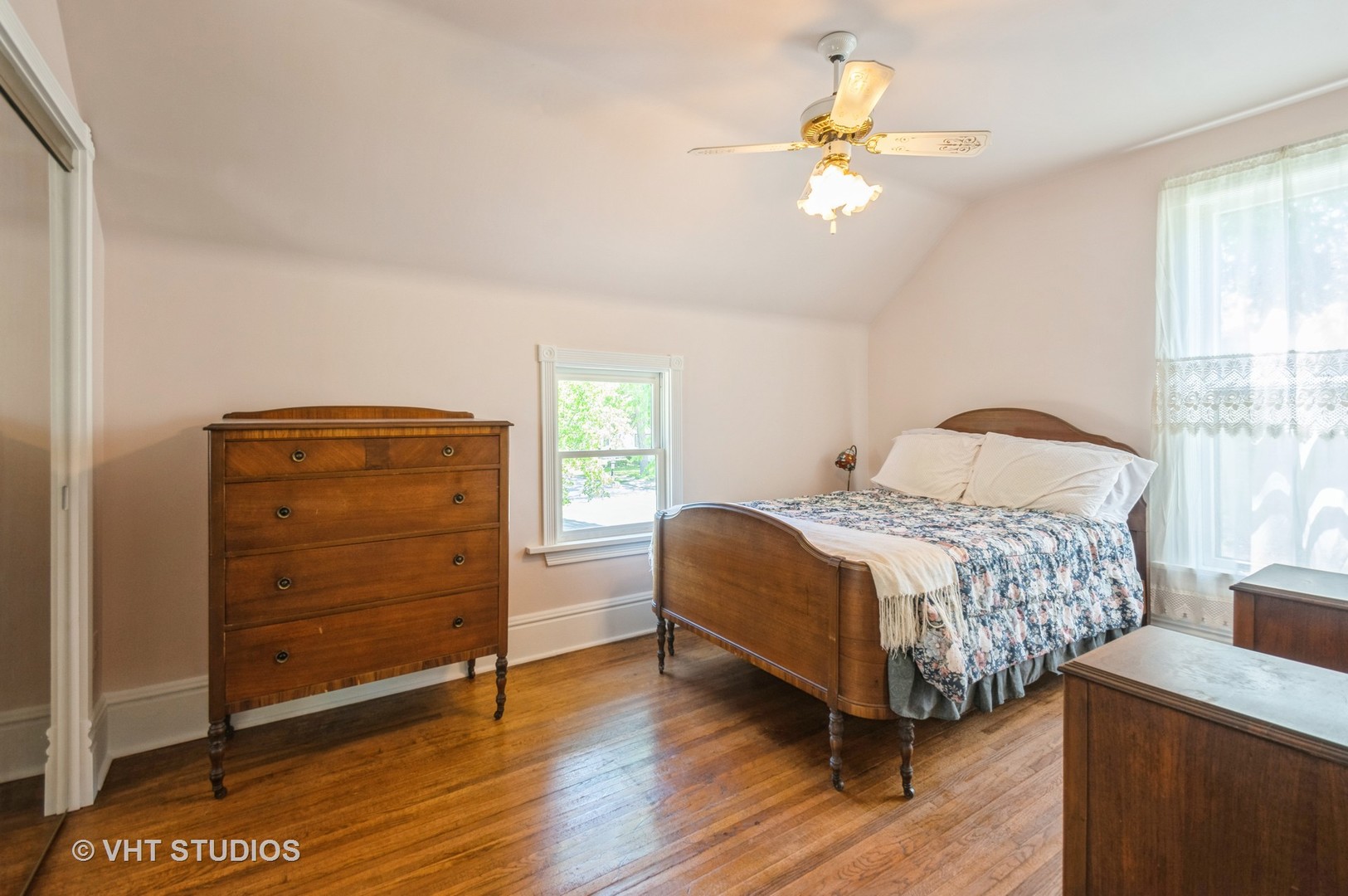 128 Forest Avenue Riverside, IL 60546 - Photo 8 of 18 a bedroom with a bed and a ceiling fan