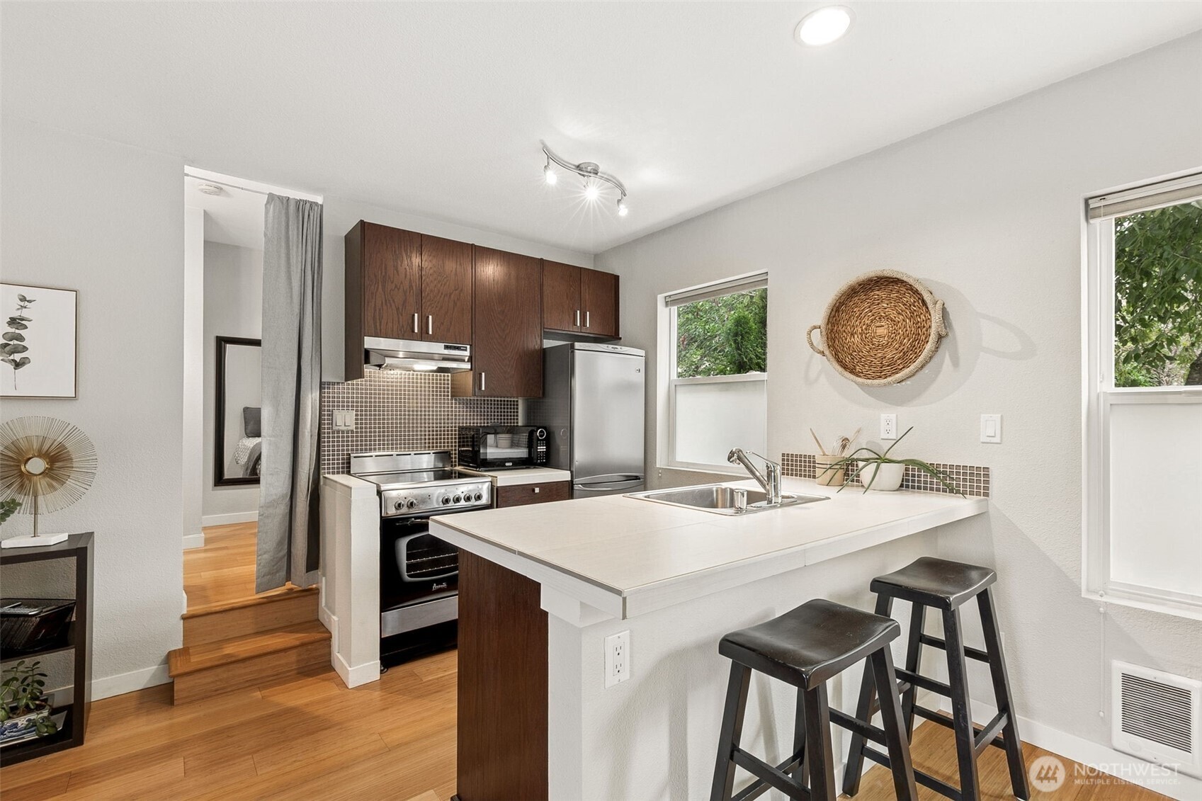 a kitchen with a table and chairs in it