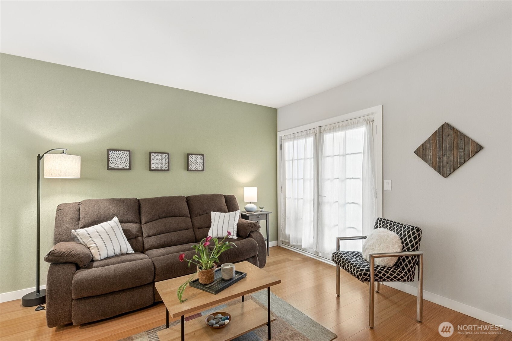 6547 42nd Avenue Southwest, Unit 205 Seattle, WA 98136 - Photo 5 of 18 a living room with furniture and a window