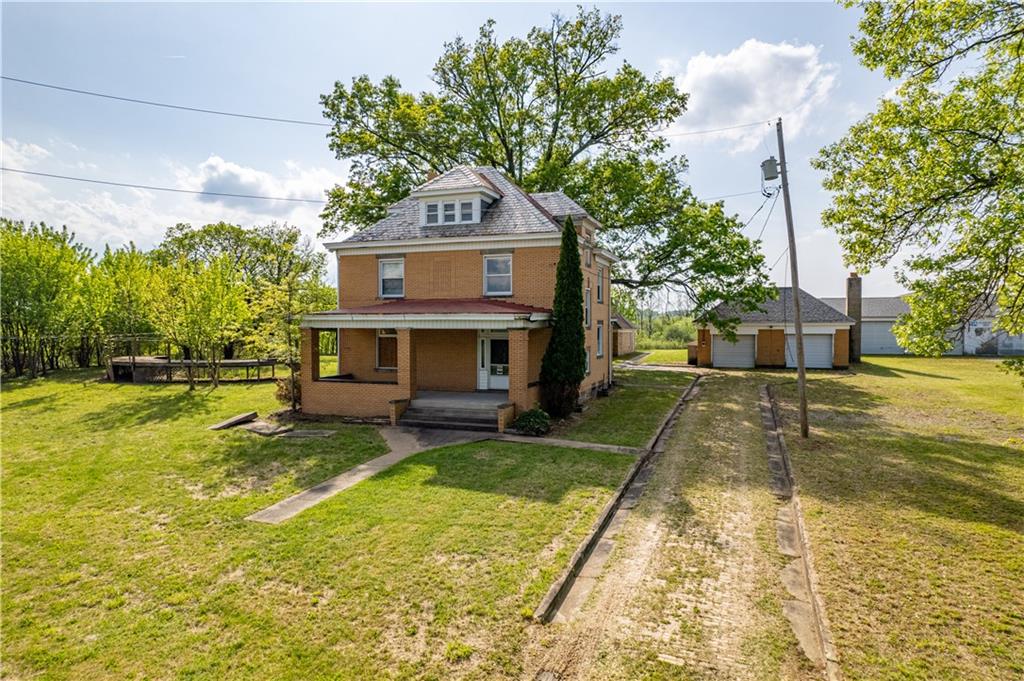 361-383 Collier Road Uniontown, PA 15401 - Photo 2 of 50 a view of a house with a yard