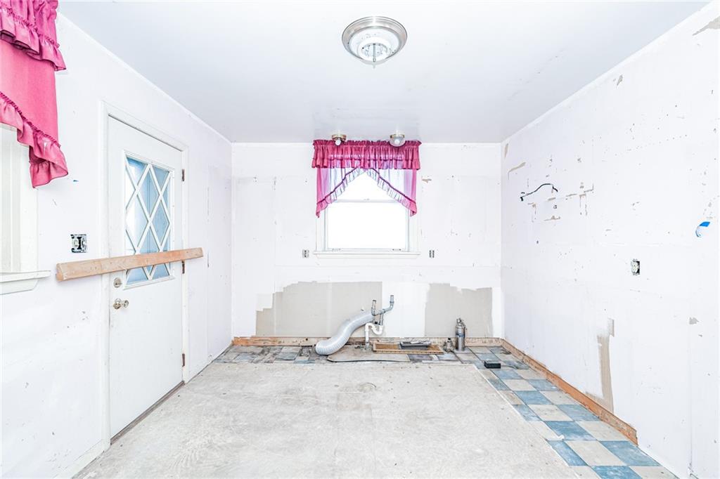 361-383 Collier Road Uniontown, PA 15401 - Photo 24 of 50 a view of a room with wooden floor and window