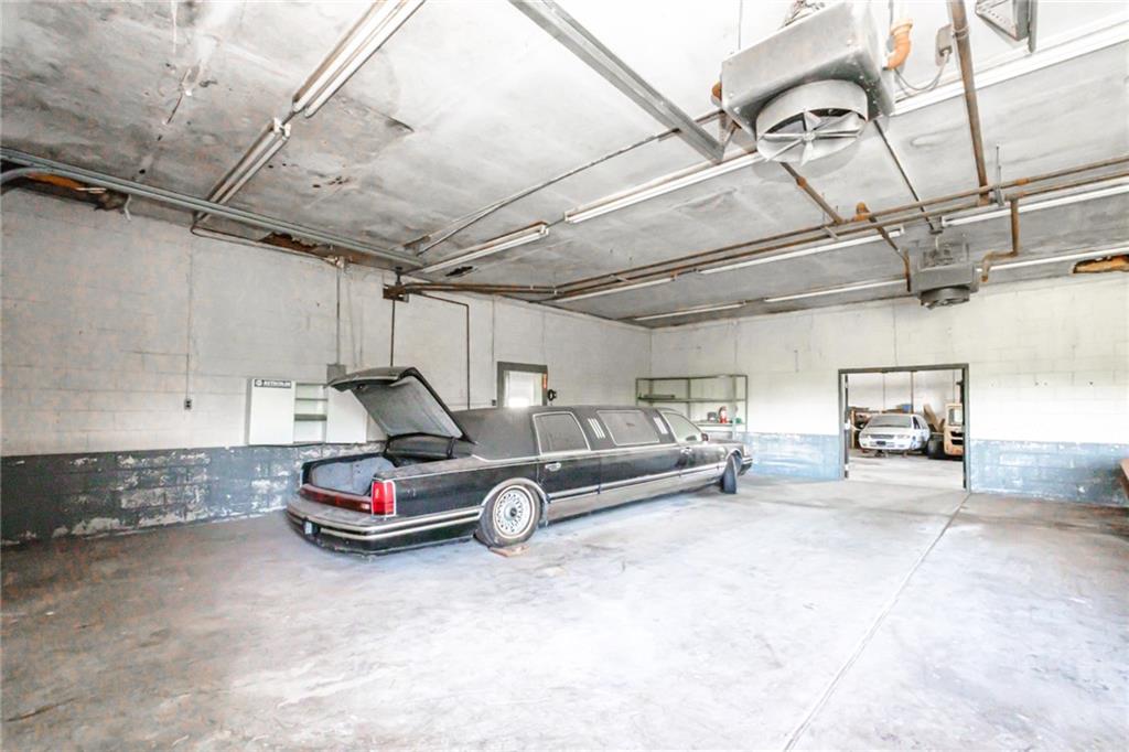 361-383 Collier Road Uniontown, PA 15401 - Photo 49 of 50 a car is parked in a garage