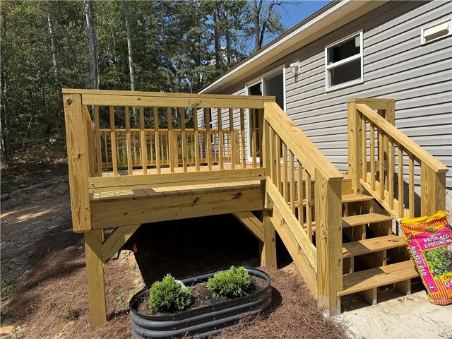 a view of balcony with a deck and furniture