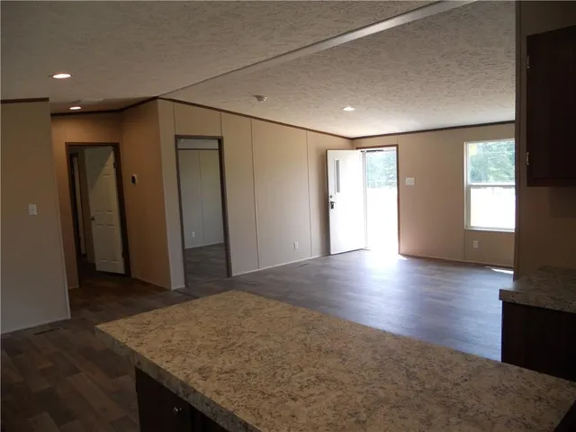 a view of livingroom with hardwood floor and hallway
