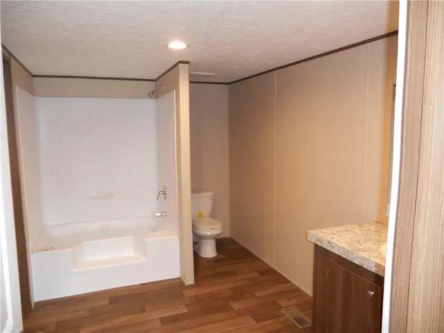 a bathroom with a shower and a glass door
