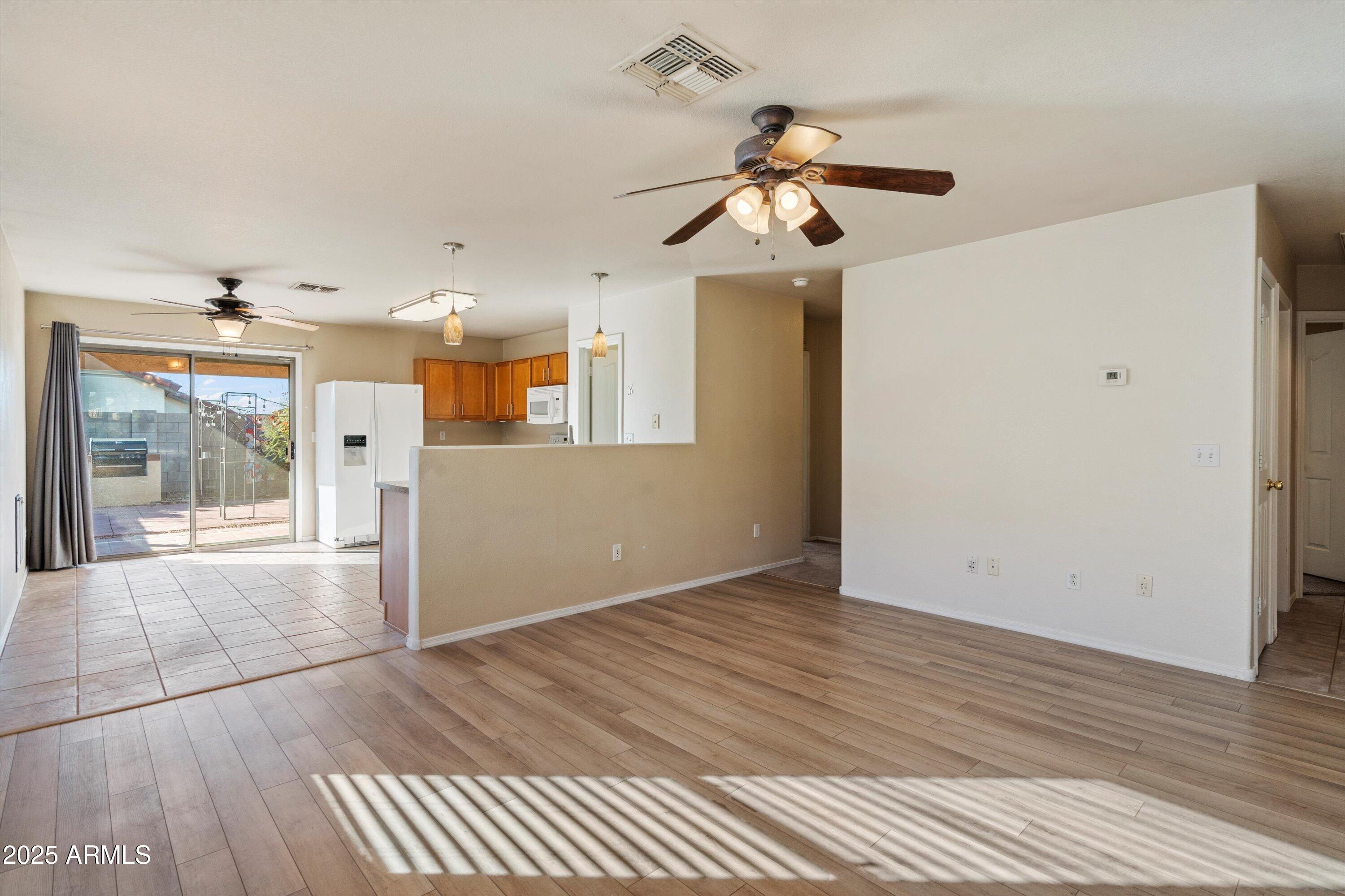 3027 West Red Fox Road Phoenix, AZ 85083 - Photo 7 of 27 07-Living to Kitchen