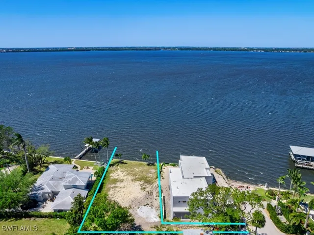 a view of a lake with a building in the background