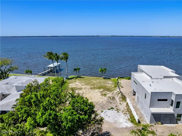 a view of a swimming pool with a table and chairs
