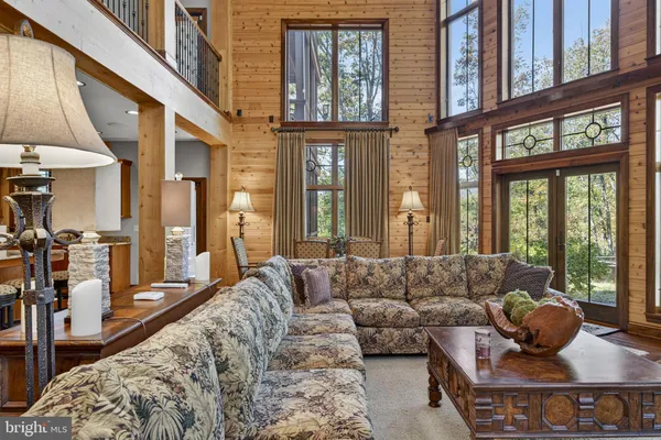 a large kitchen with granite countertop a stove and large window