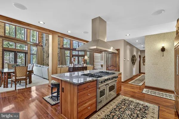 a bathroom with double vanity sinks and a large mirror