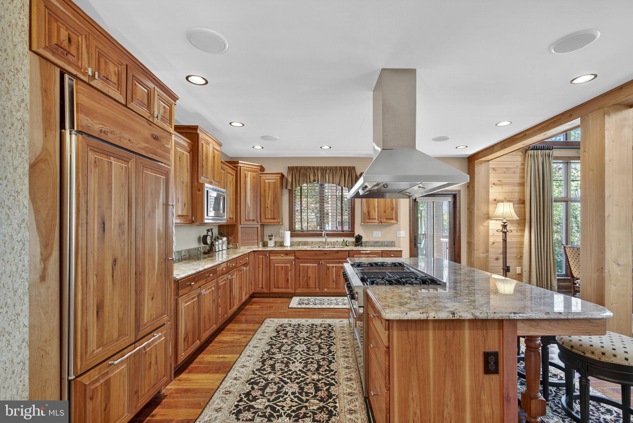 1631 Back Mountain Road Winchester, VA 22602 - Photo 19 of 86 a large kitchen with granite countertop a stove and large window