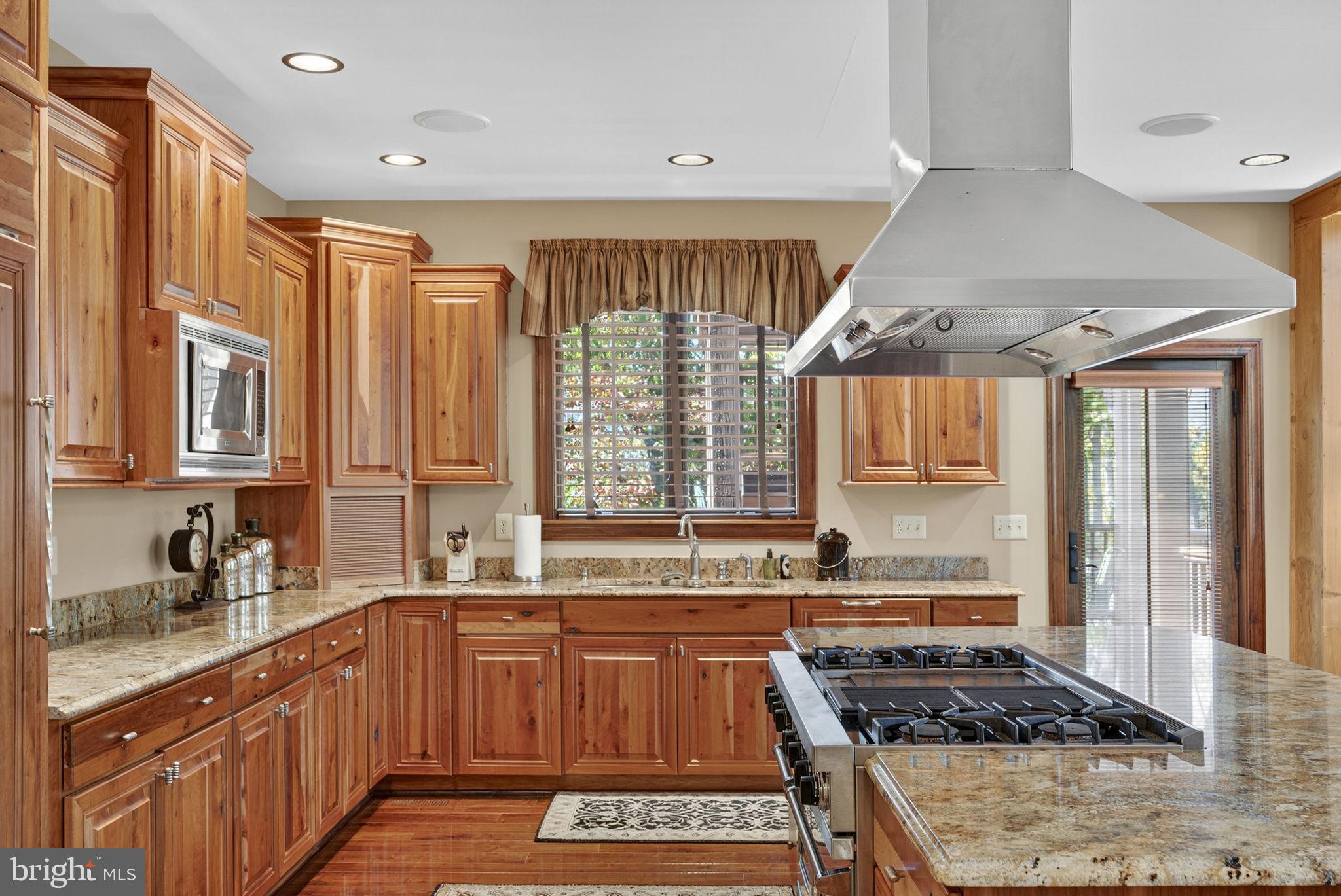 1631 Back Mountain Road Winchester, VA 22602 - Photo 20 of 86 a kitchen with stainless steel appliances granite countertop a stove a sink and a refrigerator