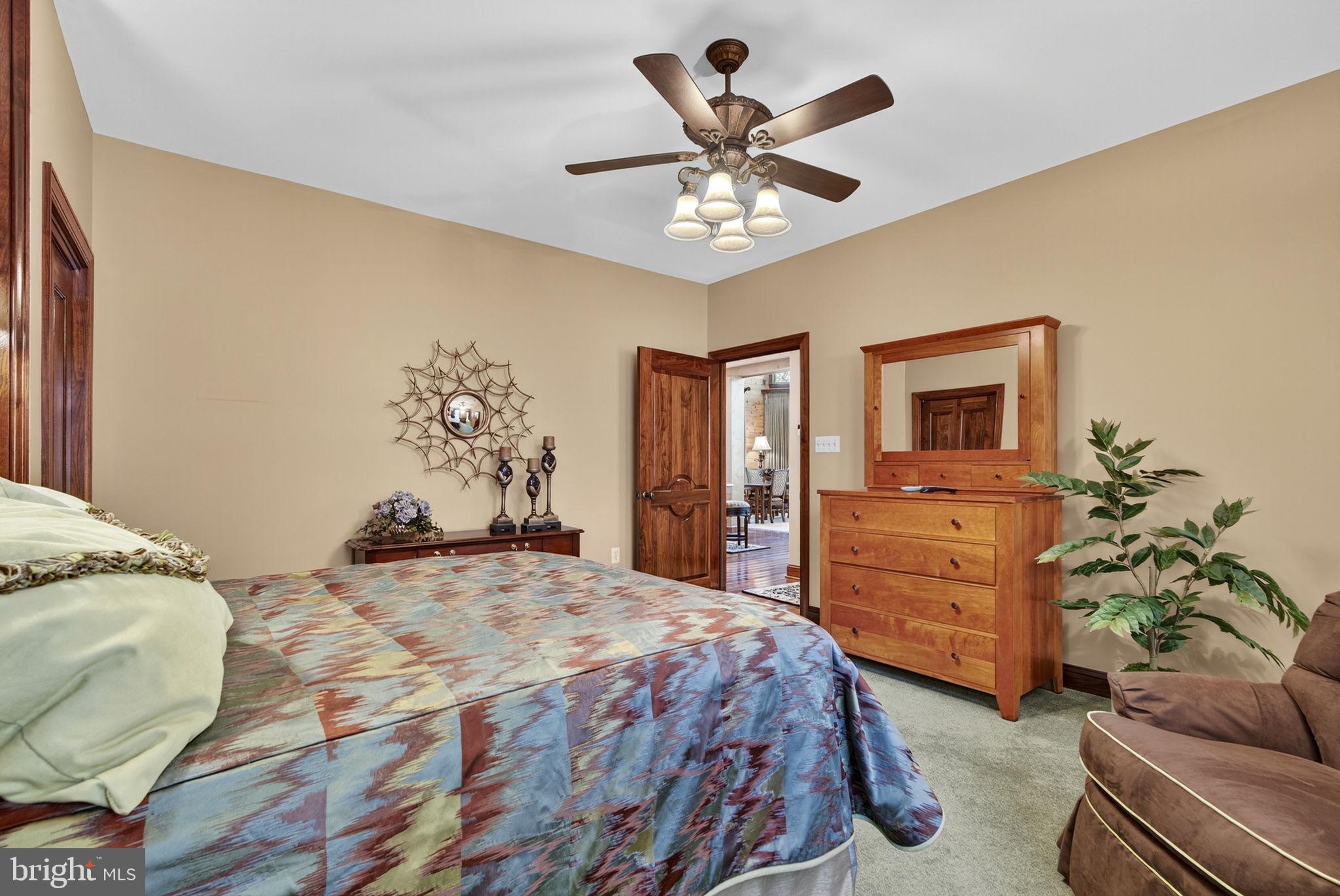 1631 Back Mountain Road Winchester, VA 22602 - Photo 22 of 86 a bedroom with a bed and ceiling fan