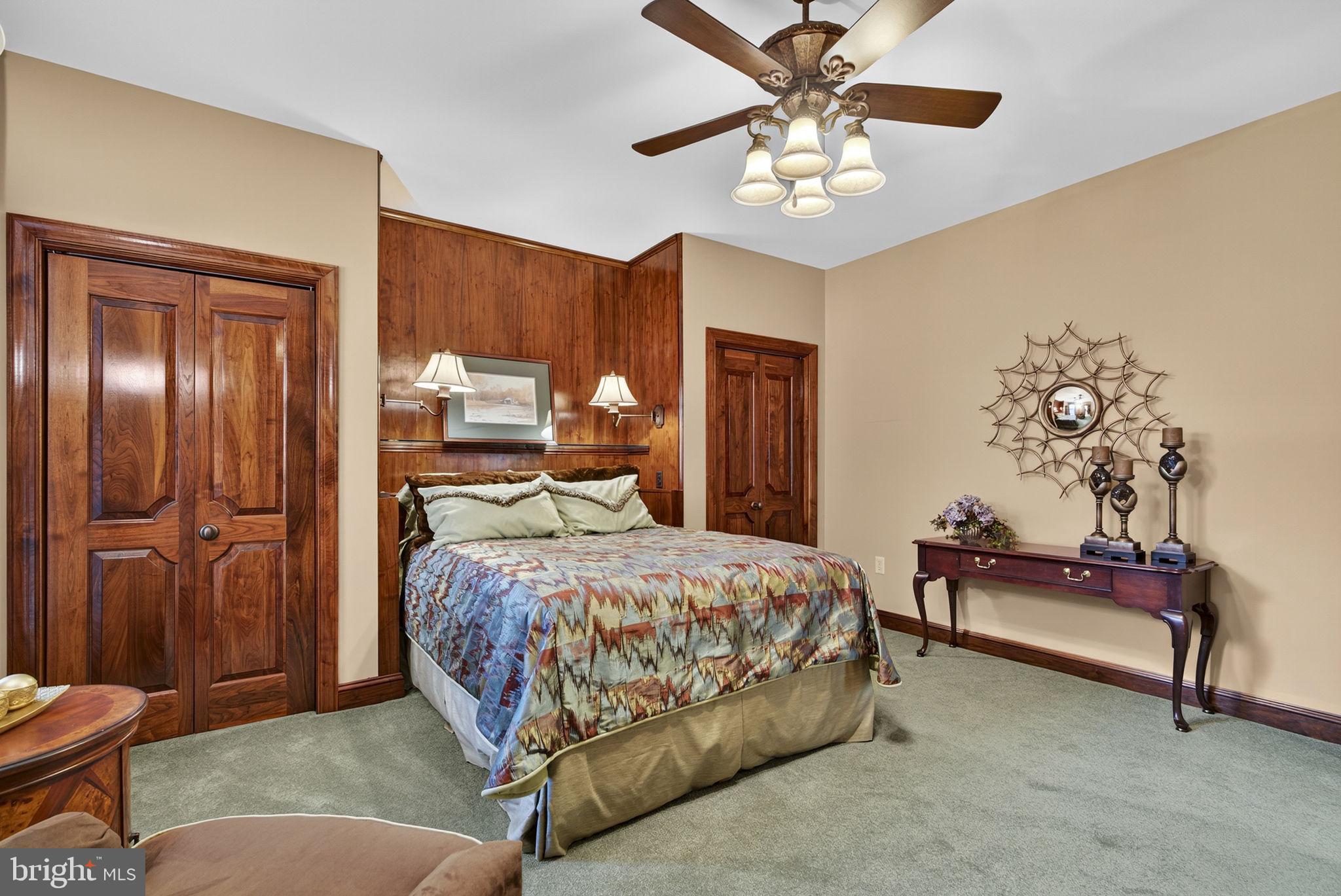 1631 Back Mountain Road Winchester, VA 22602 - Photo 23 of 86 a bedroom with a bed and a chandelier