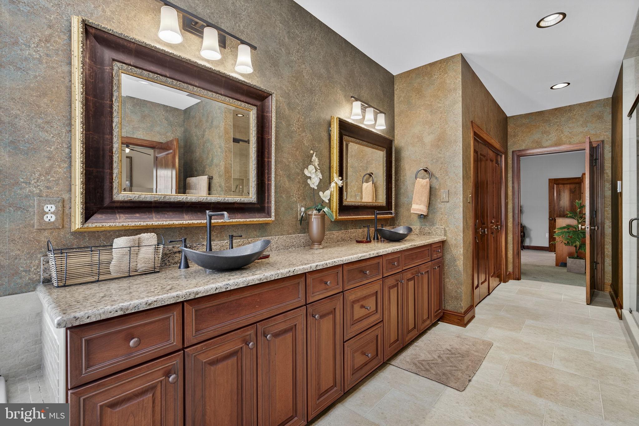 1631 Back Mountain Road Winchester, VA 22602 - Photo 27 of 86 a bathroom with double vanity sinks and a large mirror