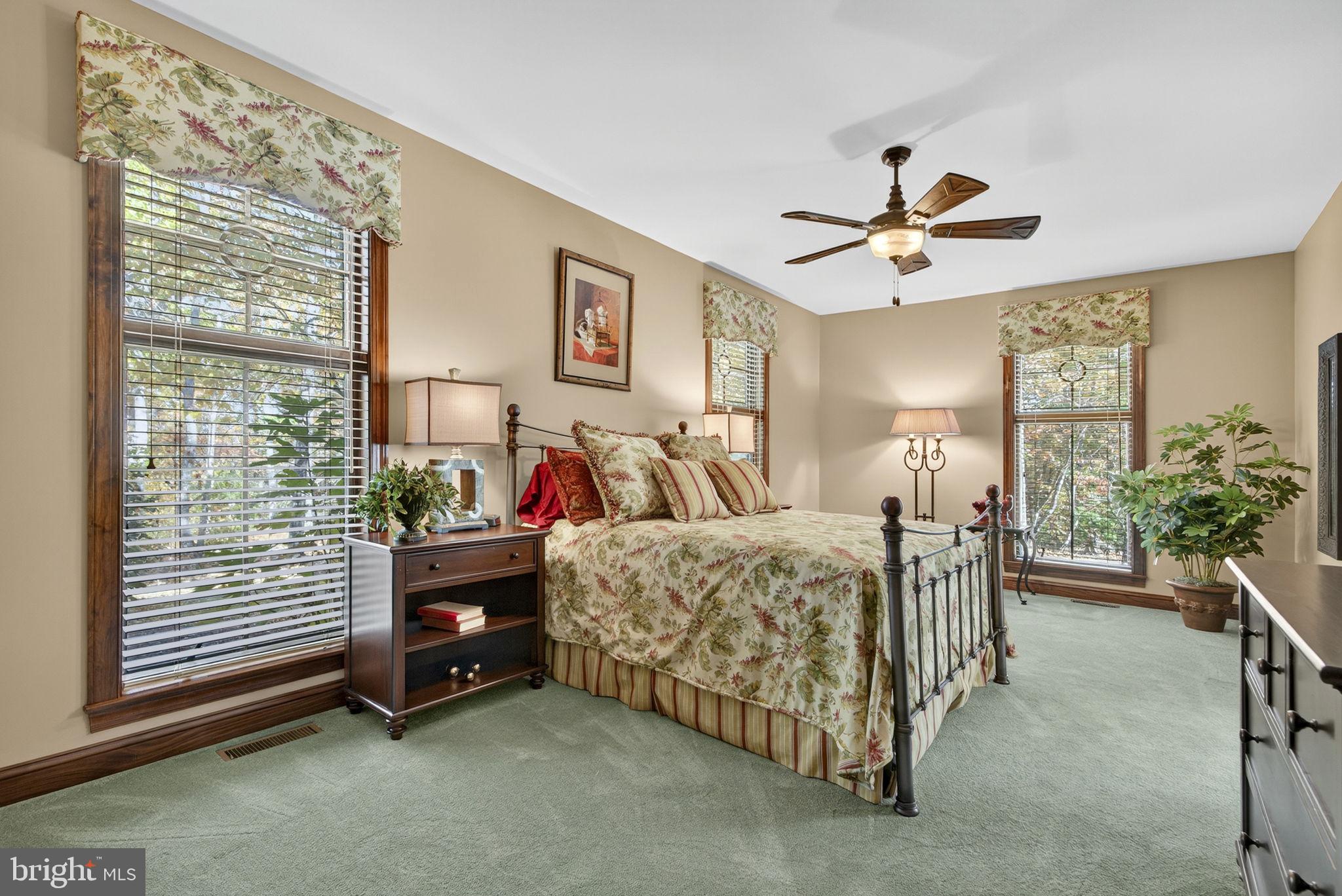 1631 Back Mountain Road Winchester, VA 22602 - Photo 30 of 86 a bed room with a bed and a chandelier