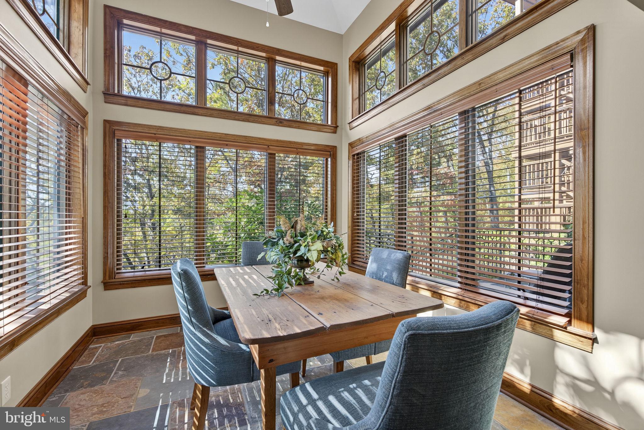 1631 Back Mountain Road Winchester, VA 22602 - Photo 37 of 86 a view of a dining room with furniture large windows and wooden floor