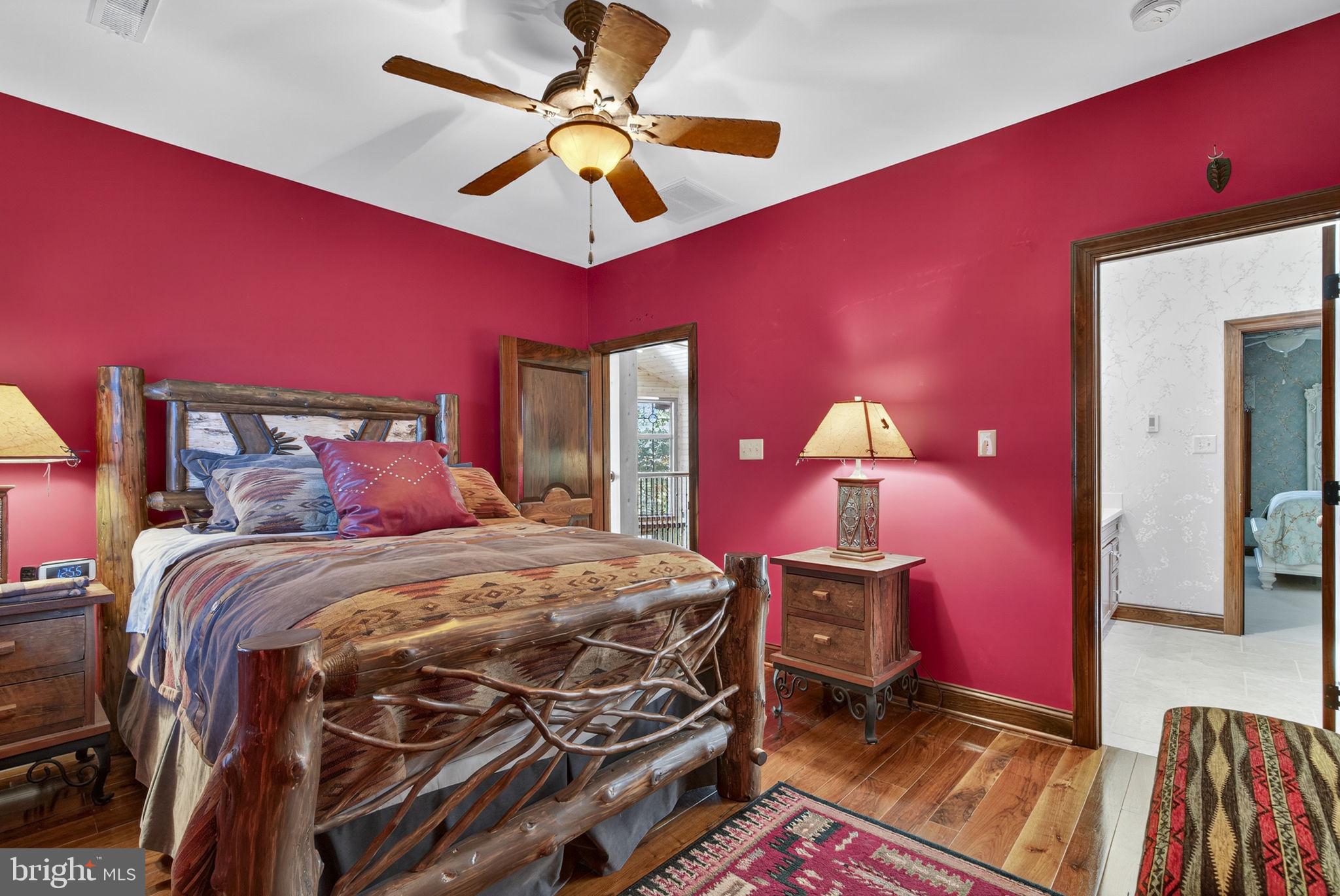 1631 Back Mountain Road Winchester, VA 22602 - Photo 50 of 86 a bedroom with a bed and a chandelier