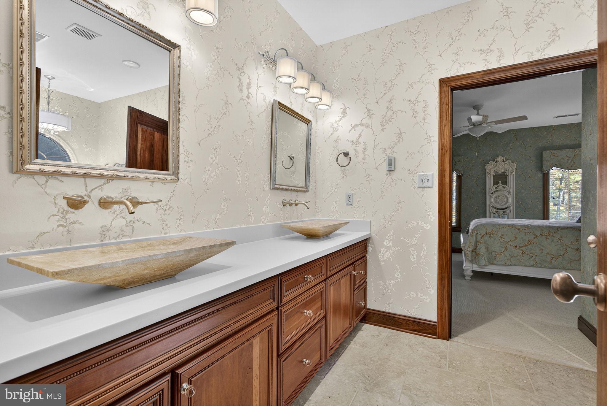 1631 Back Mountain Road Winchester, VA 22602 - Photo 51 of 86 a en suite bathroom with a double vanity sink and a mirror