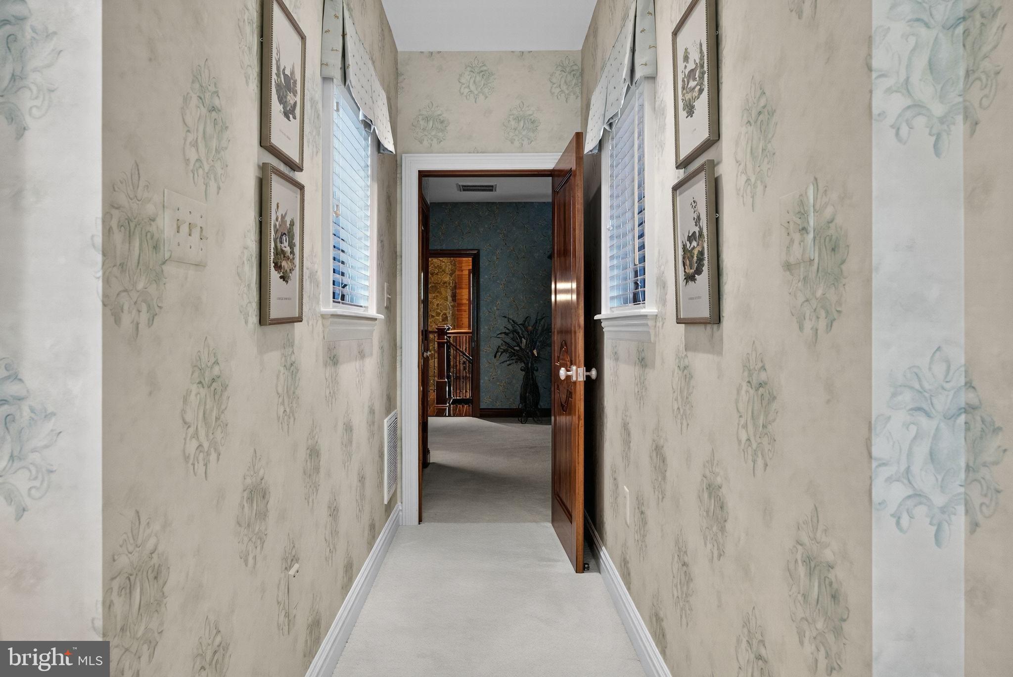 1631 Back Mountain Road Winchester, VA 22602 - Photo 62 of 86 a view of a hallway with a wooden door
