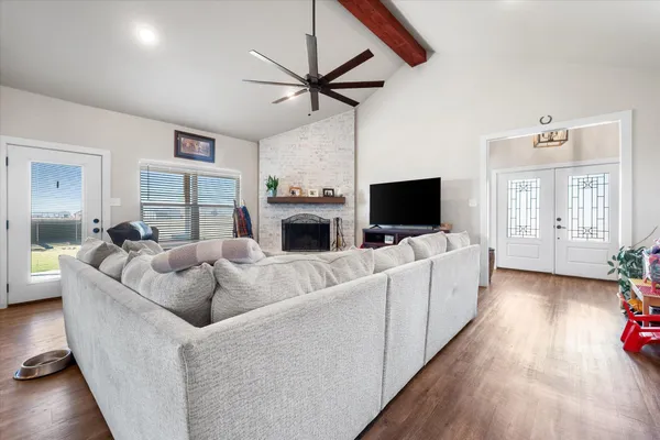 a living room with furniture and a flat screen tv