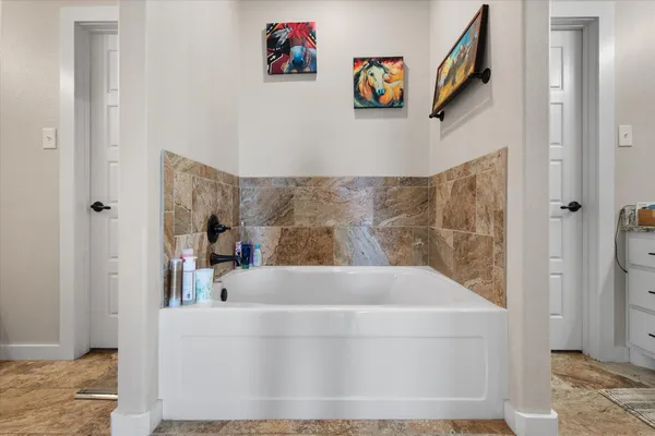 a bath tub sitting in a bathroom