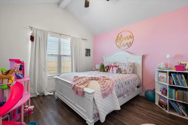 a bedroom with a bed and a book shelf