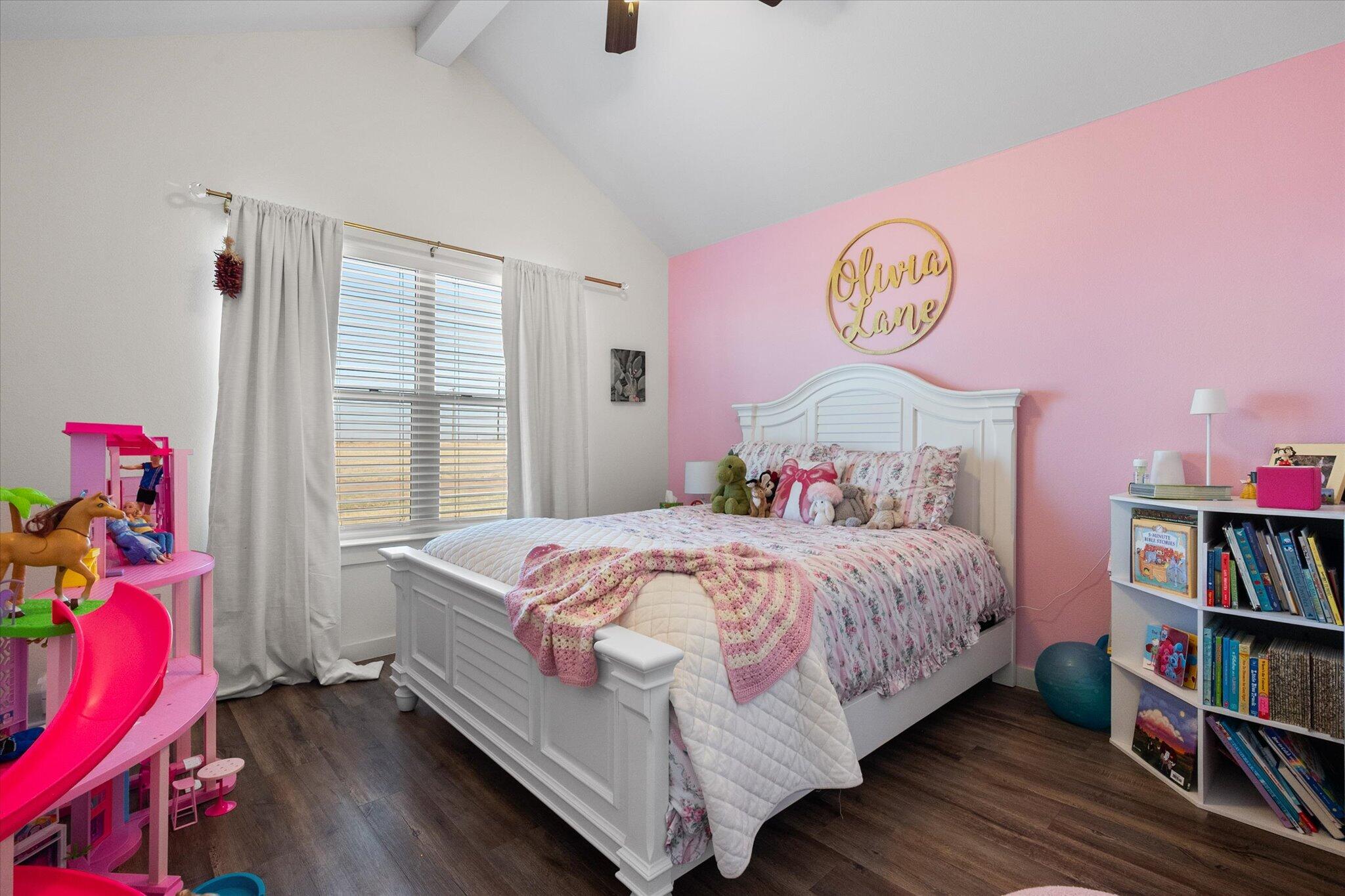 3263 Quail Road Lubbock, TX 79407 - Photo 23 of 46 a bedroom with a bed and a book shelf
