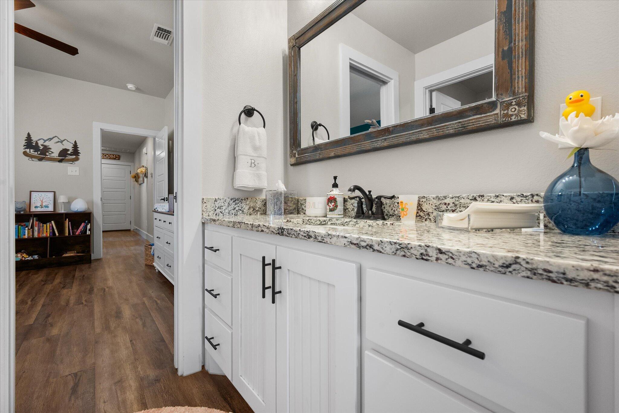 3263 Quail Road Lubbock, TX 79407 - Photo 25 of 46 a kitchen with cabinets a sink and appliances