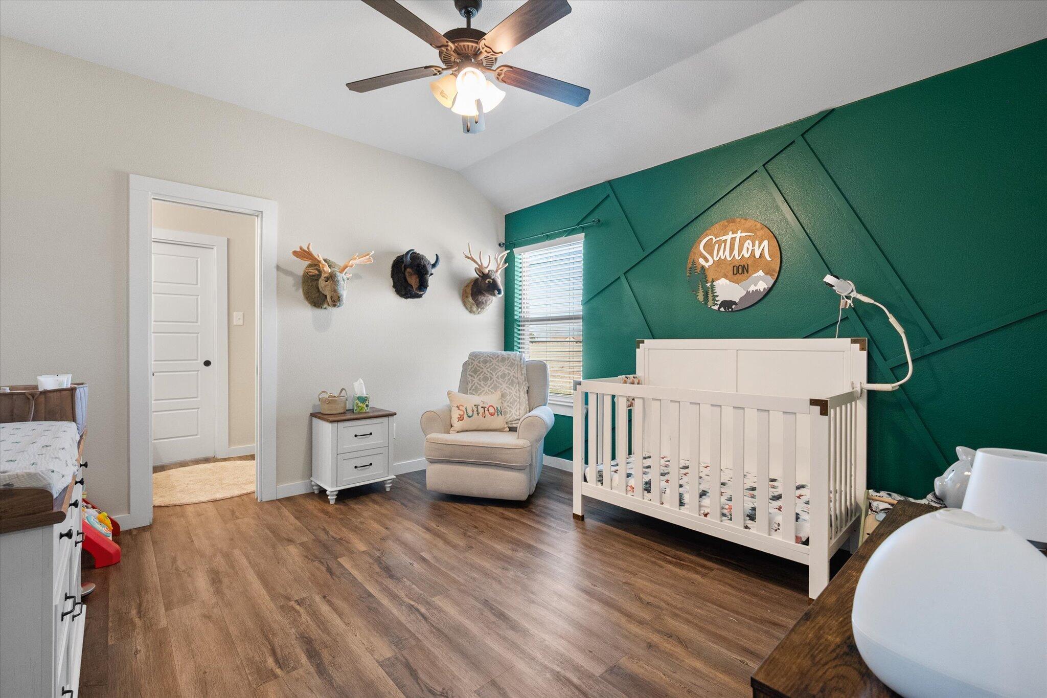 3263 Quail Road Lubbock, TX 79407 - Photo 27 of 46 a living room with furniture and a wooden floor