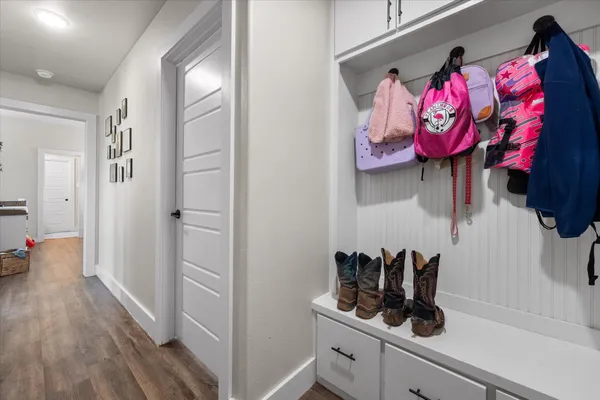 a view of a room with rack on the wall and dresser