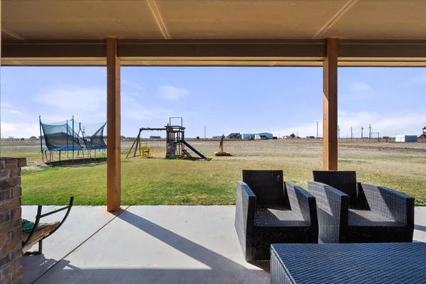 a view of a swimming pool and a back yard